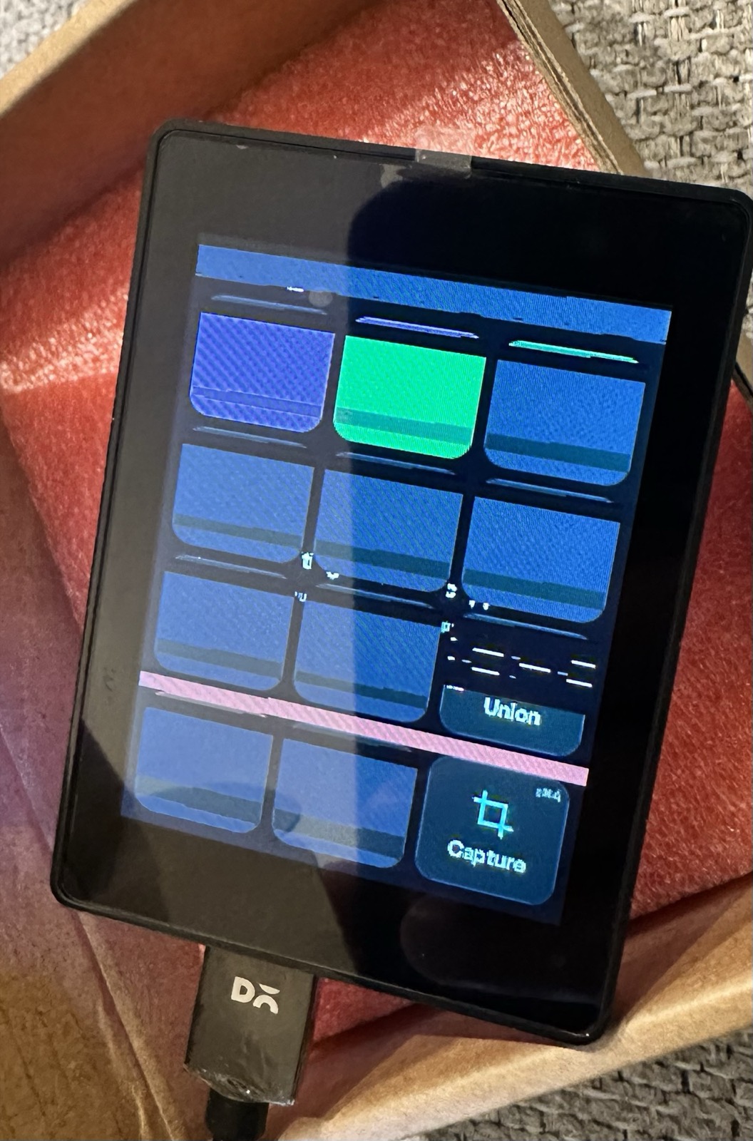 The keypad screen showing garbled overlapping tiles